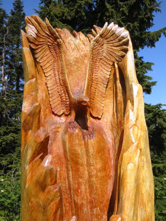 a statue with wings on the front of it