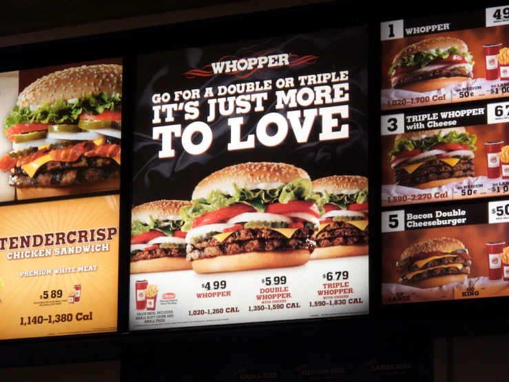 billboard boards advertising burgers are shown on display