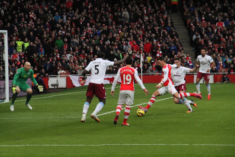 the players are playing soccer on a field