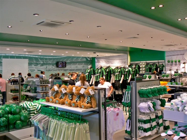 people are shopping for some kind of green and white merchandise