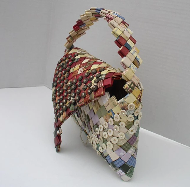 a multicolored paper purse is made to look like a bag