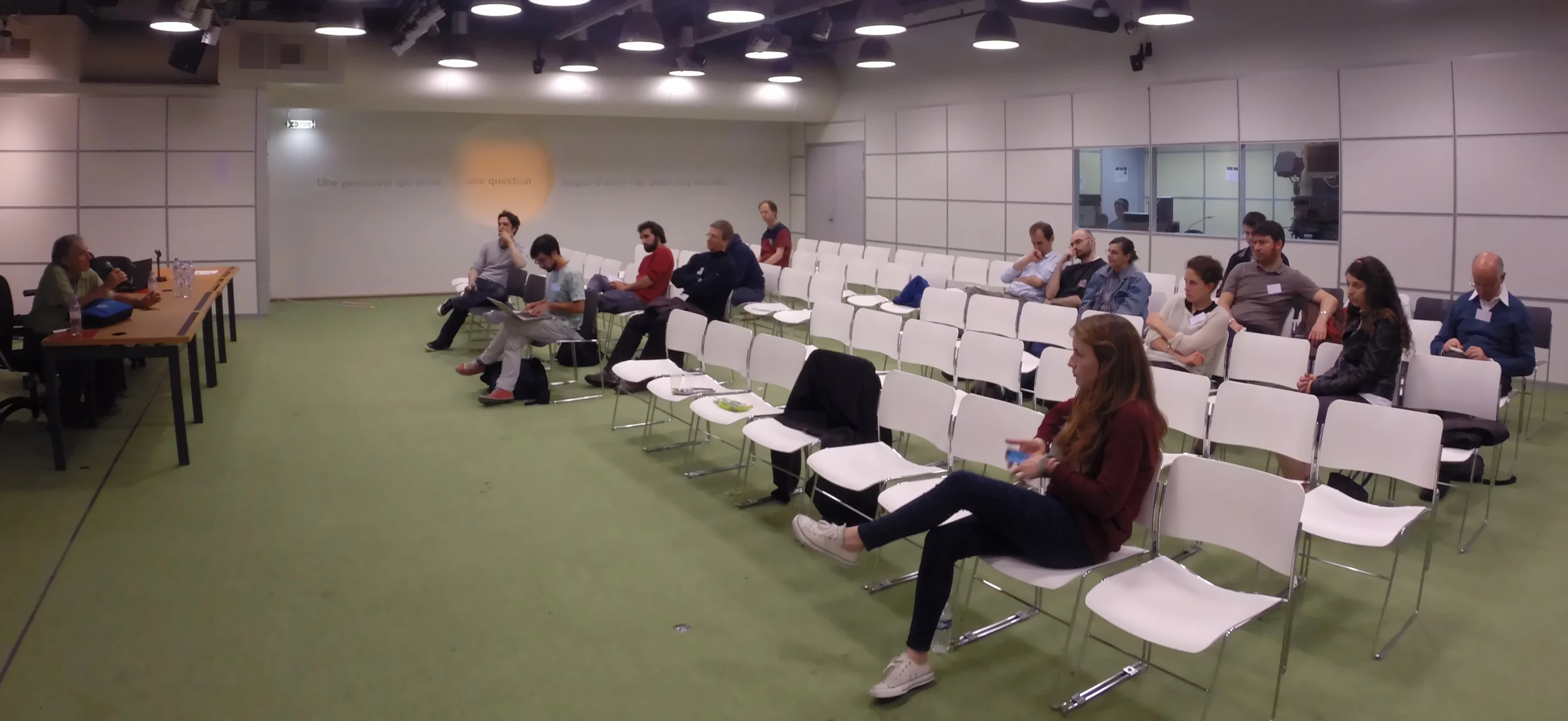 an audience sitting in rows waiting to participate