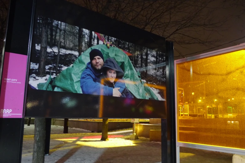 the large billboard is displaying a couple on it