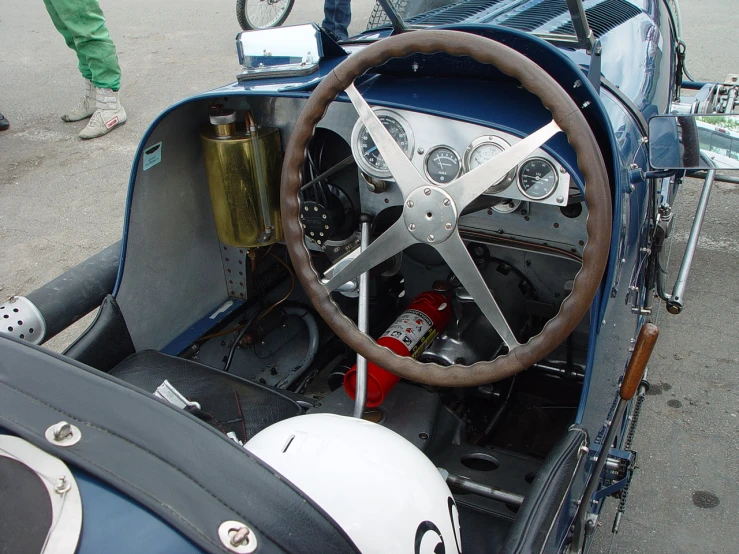 a classic car with a steering wheel that is open