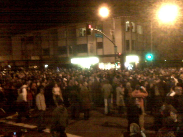 a large group of people gathered in front of a building