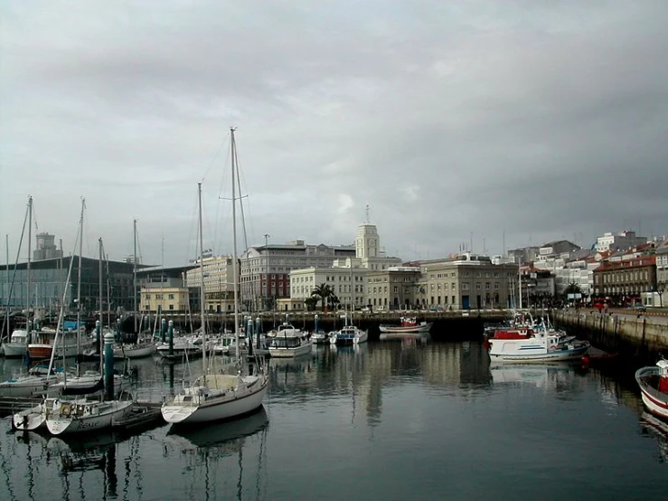 boats are docked at the dock of a town