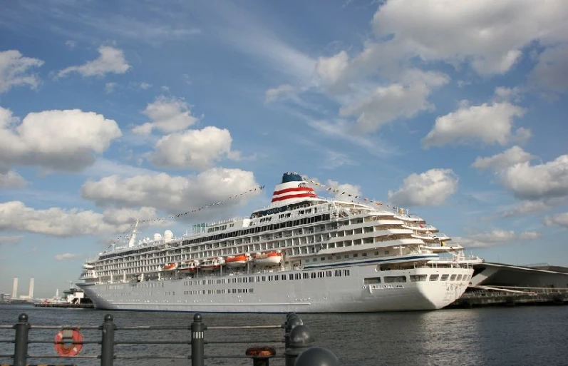 a large cruise ship docked in a body of water