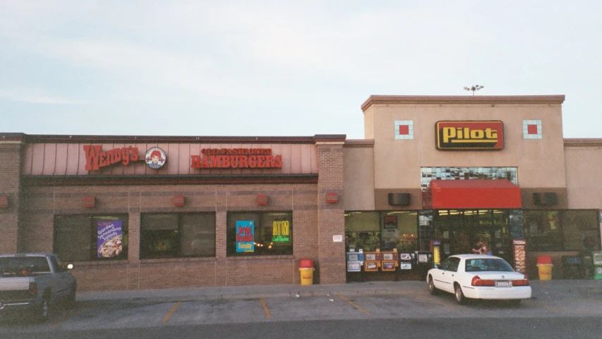 an old store with the doors and windows open