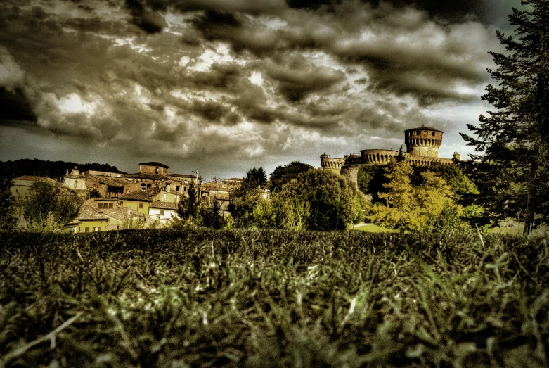 a large castle sitting on top of a hillside next to trees