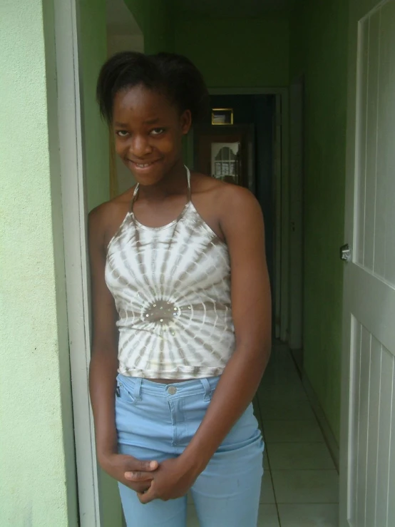 a smiling young woman wearing a crop top