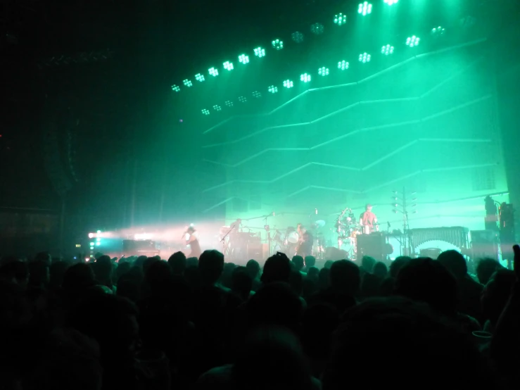 the crowd is watching people perform on stage