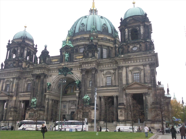 an old church with many spires, and tall buildings with windows