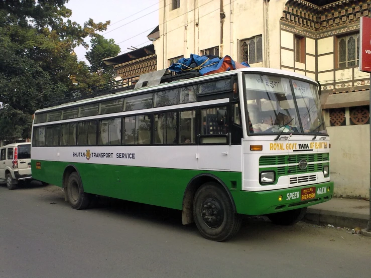 a bus is seen sitting in front of a building