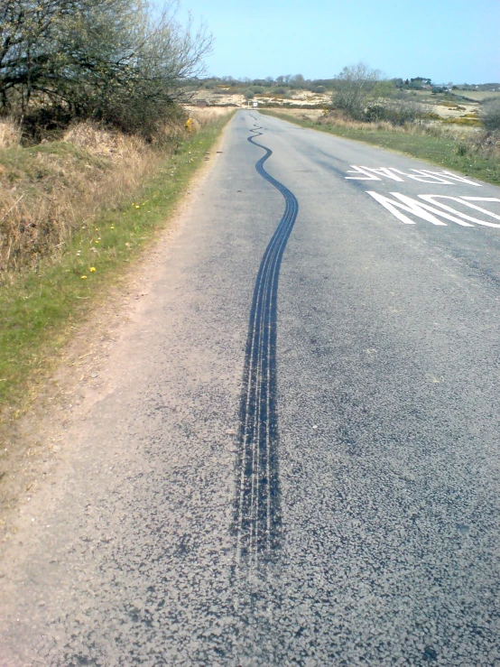 there is a strip of street that has drawn tracks on it