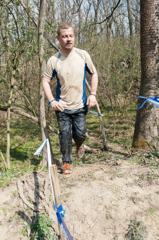 a man is running in the woods on a trail