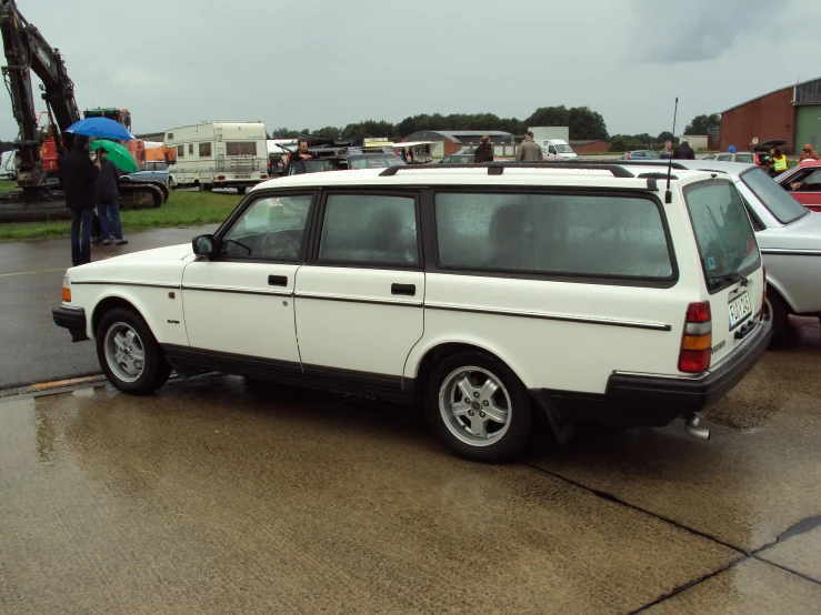 the car is parked on the wet pavement