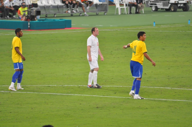 two men are on a field playing soccer