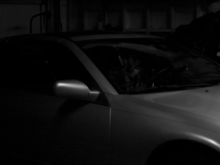 a dog sitting in the car window, staring at his owner