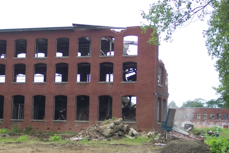 an empty old brick building that needs repair