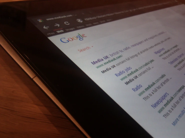 a computer tablet displays google search on it