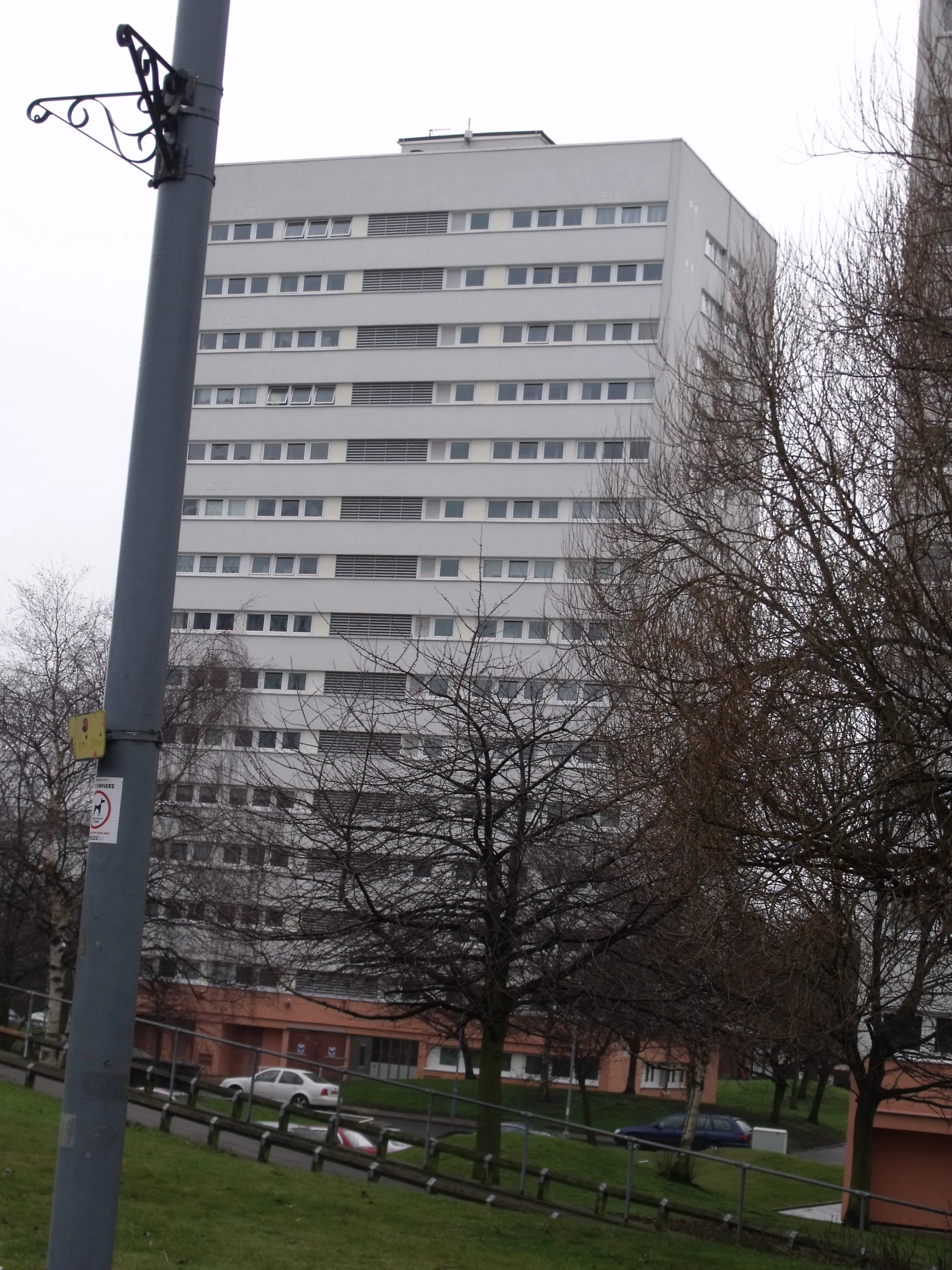 there is a very large white building next to a field