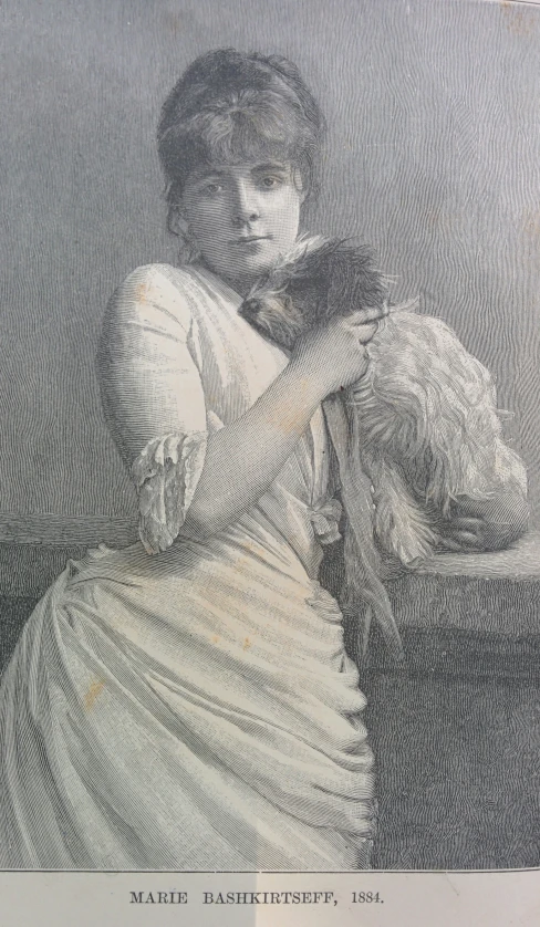 a woman with her hand on her chest, holding an arm in her other hand