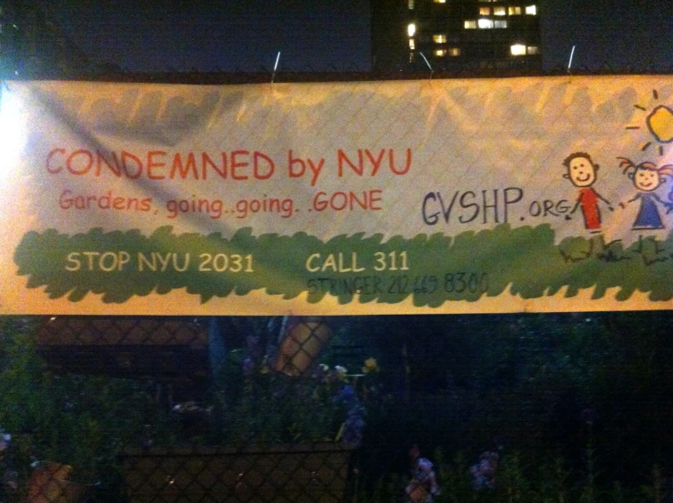 the banner for an event is posted on the fence