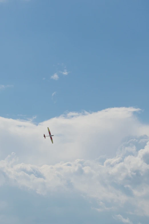 two airplanes flying high up in the sky