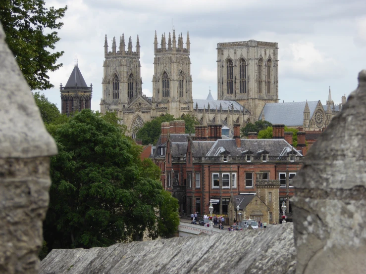 a city from across a bridge with the old buildings in the background