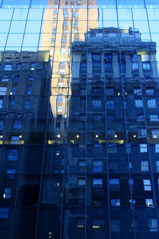 the side of the building is reflecting the light from the windows