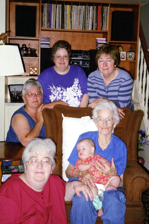 a group of women sitting in a living room together