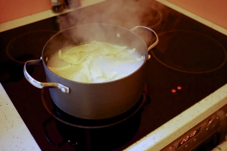 a saucepan that has some food in it on the stove