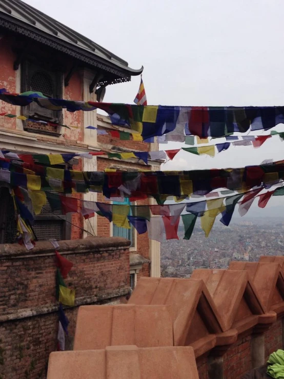 some different colored streamers hanging from a roof