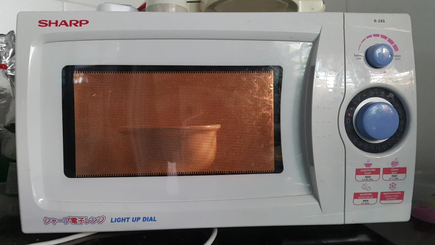 this microwave is heating in the kitchen on the stove