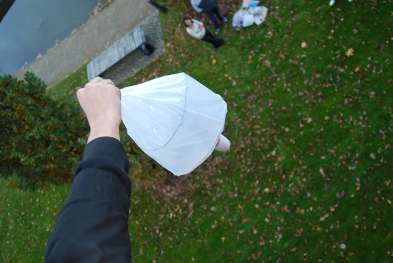 a person is holding up a bag with another person around it