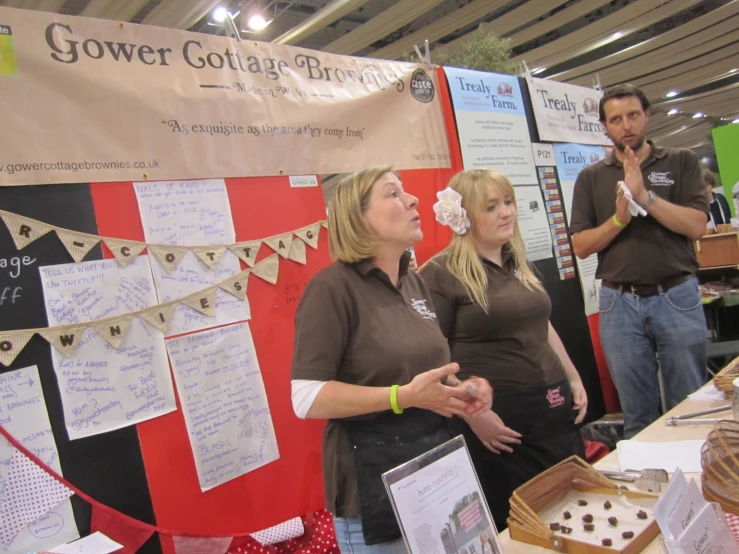 people standing by a display in a building