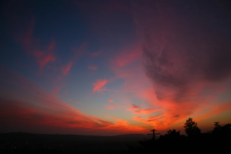 a very colorful sky at night with clouds