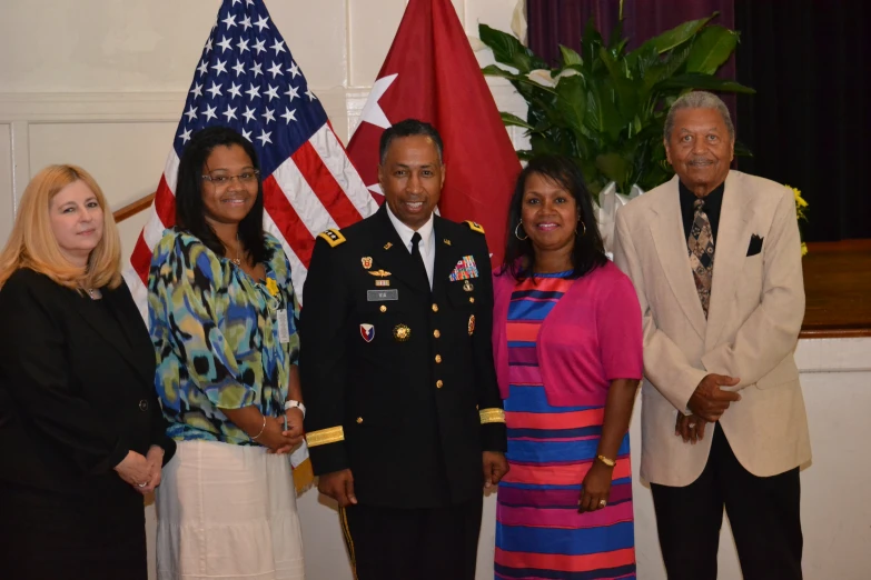 four people in military uniforms posing for a picture