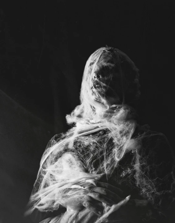 black and white image of a woman with smoke