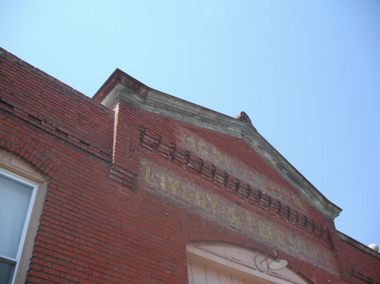 an old building has graffiti written on the side of it