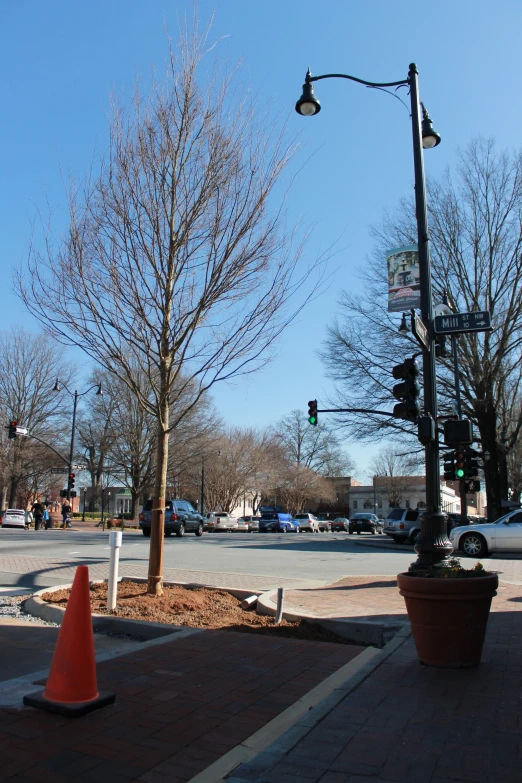 this traffic light is green at the corner of an intersection