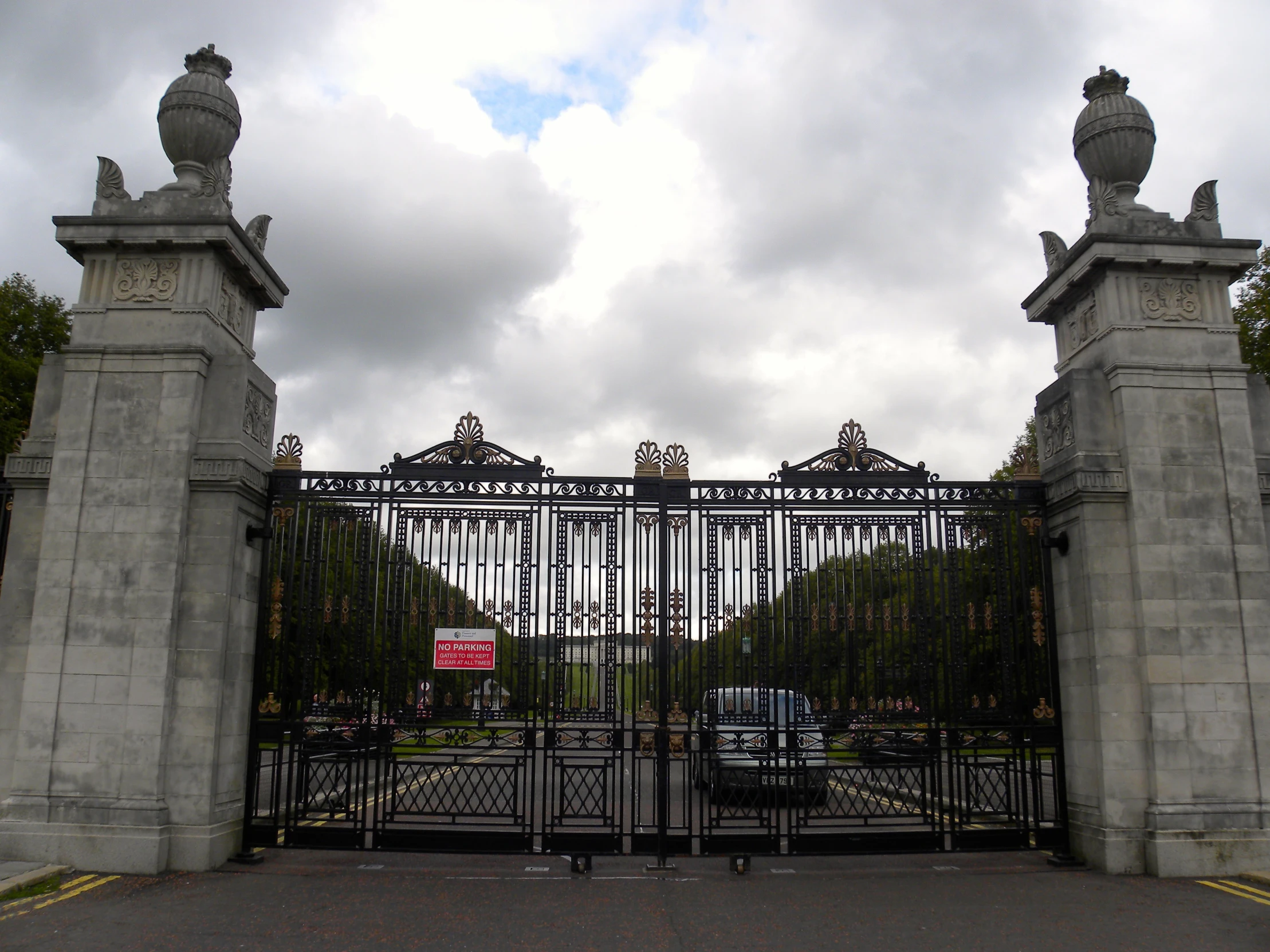 a big gate that has a sign on it