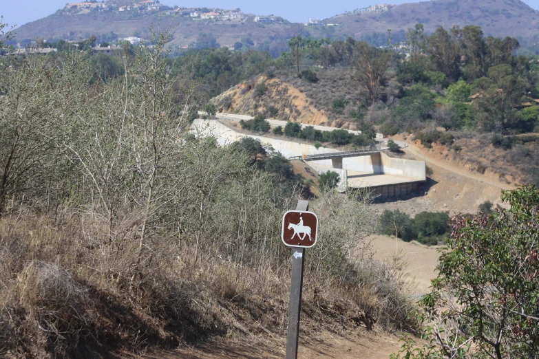 a sign on a path saying horse trail