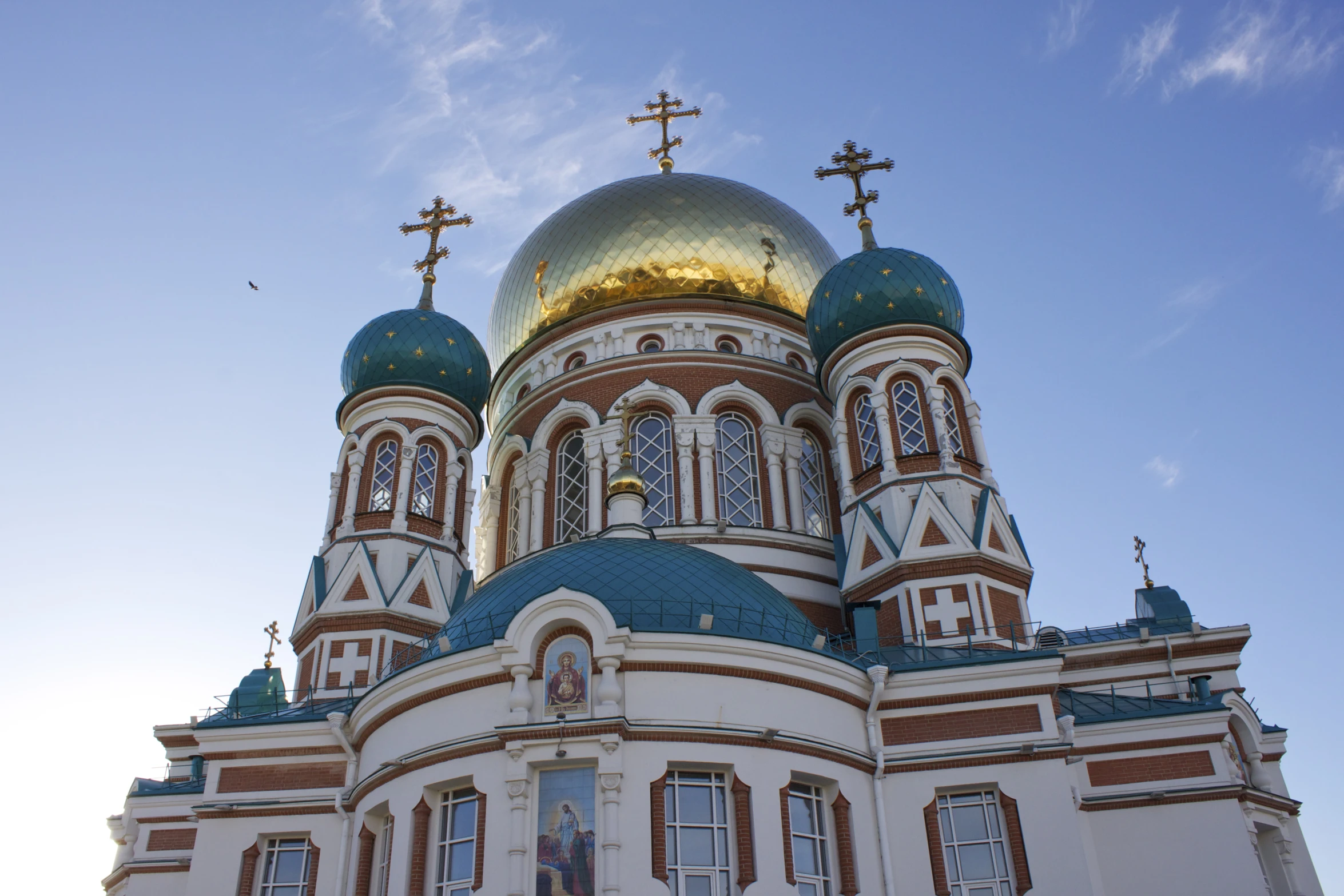 the ornate church has many golden domes