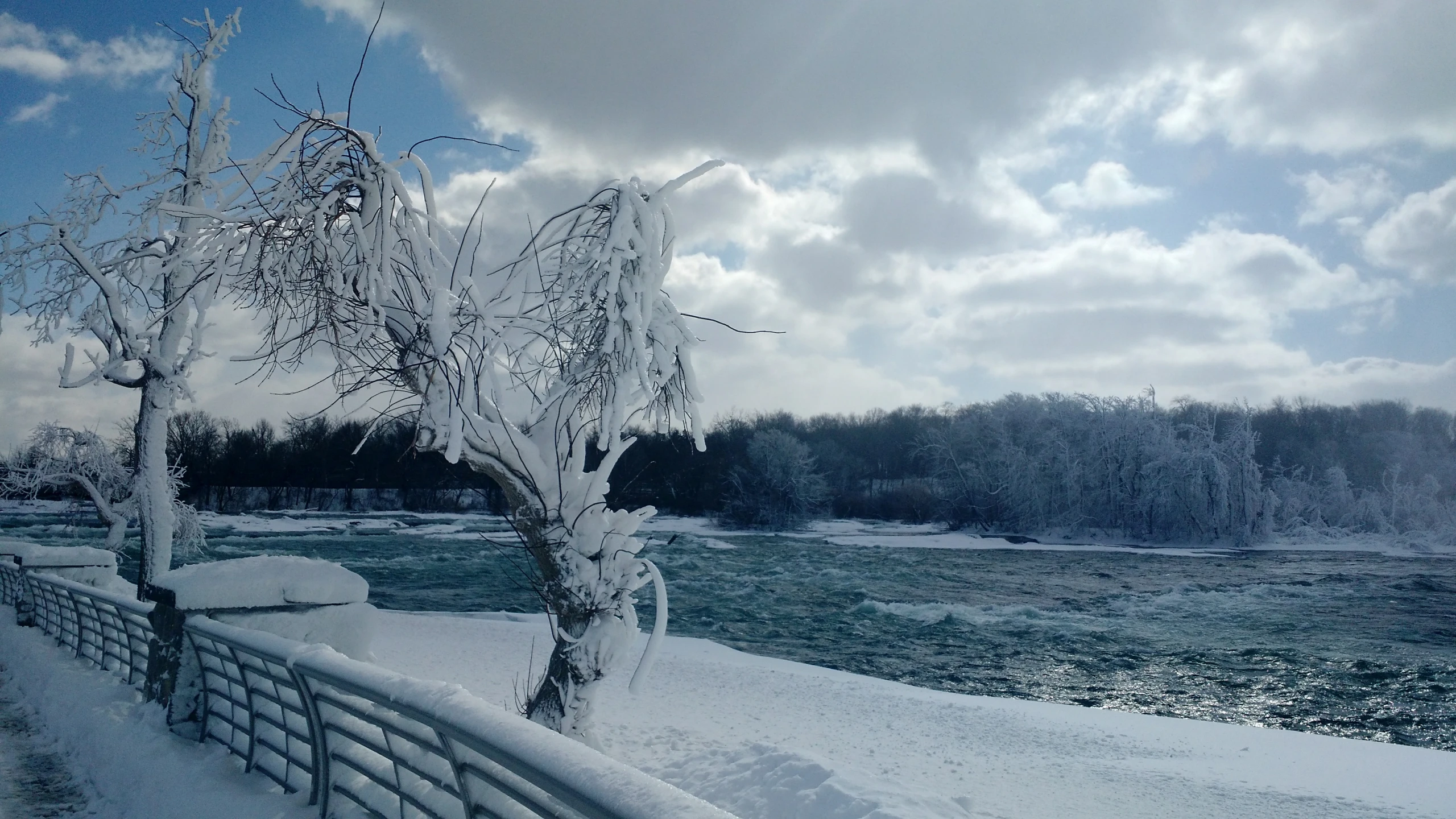 winter scene of a snowy and icy river