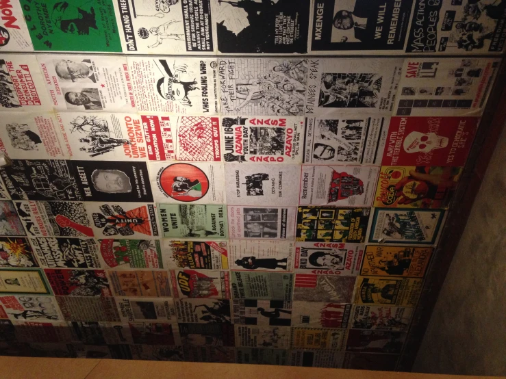 several black and white flyers on the wall