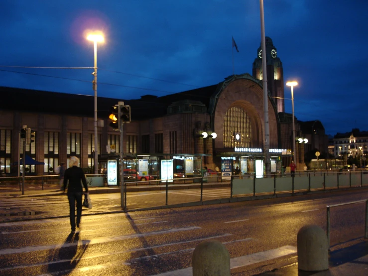 a man walking alone on a deserted city street