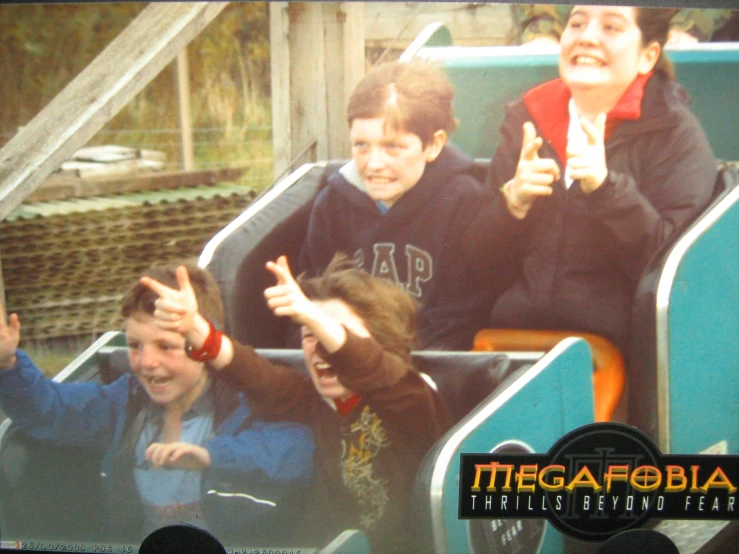 some people are riding a roller coaster at a carnival