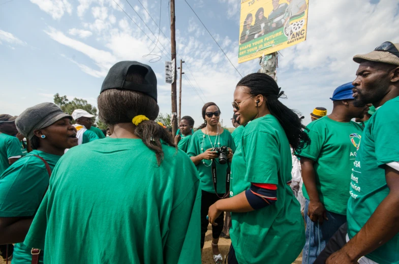 several people are gathered to take part in a rally