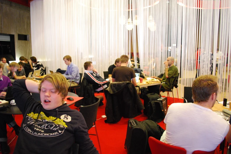 people in a conference room eating and drinking together